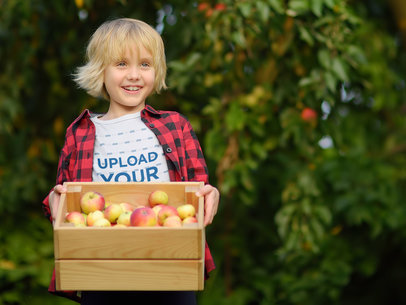 T-Shirt Mockup of a Boy Holding a Box of Apples m18846-r-el2