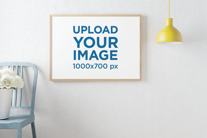 Mockup of an Art Print Hanging on the Wall Featuring a Blue Chair with Flowers