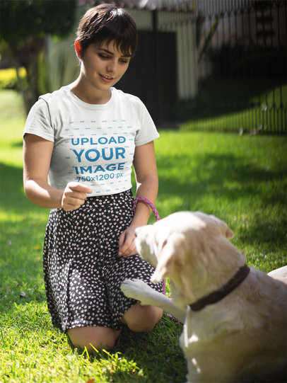 Pretty Woman Training her Dog while Wearing a Round Neck Tee Mockup