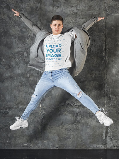 T-Shirt Mockup of a Man Jumping and Extending His Arms m3204-r-el2