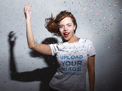 Redhaired Woman Wearing a Tshirt Mockup while Under a Confetti Rain a18018