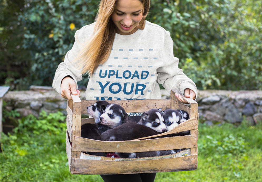 Heathered Sweatshirt Mockup Featuring a Woman Holding a Box With Puppies