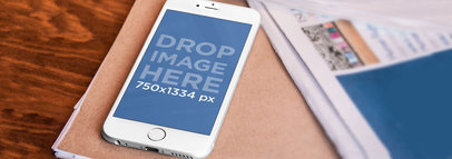 Wide Mockup of a White iPhone 6 on an Office Desk