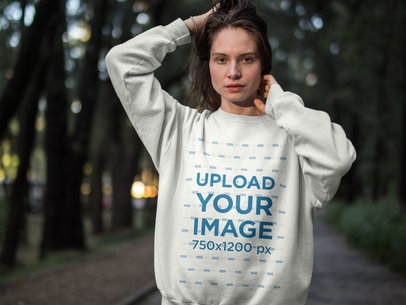 Blonde Woman Wearing a Crew Neck Sweatshirt Template while in the Woods