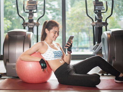 Sports Bra Mockup Featuring a Young Woman Checking Her Phone at the Gym m15127-r-el2