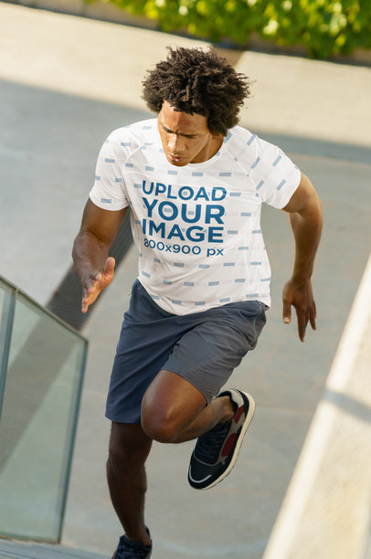 T-Shirt Mockup of a Man Running up a Stairway