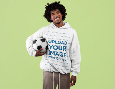 Pullover Hoodie Mockup of a Smiling Man with Afro Hairstyle Holding a Soccer Ball m19419 r-el2