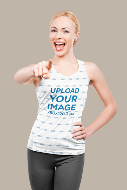 Tank Top Mockup of a Happy Woman Pointing to the Camera with Her Finger
