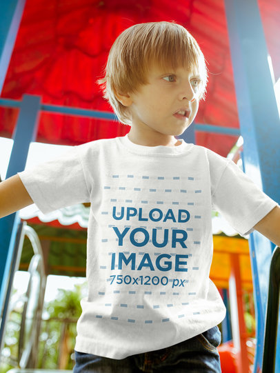 Blonde Kid Wearing a Tshirt Mockup while at the Playground