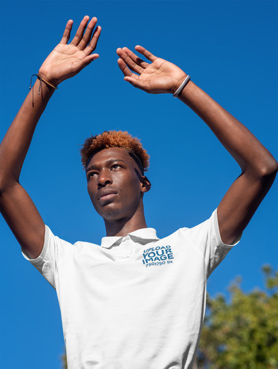 Polo Shirt Mockup of a Trendy Young Man Raising His Arms