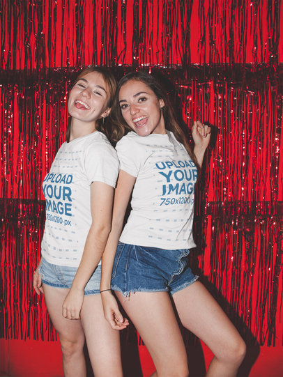 Mockup of Two Friends Wearing Tees in Front of a Shimmering Curtain 17968