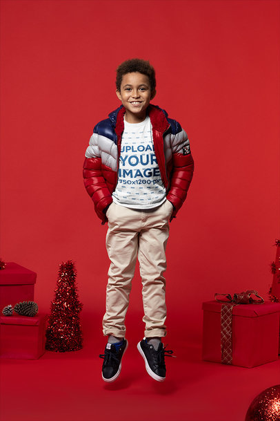 Xmas-Themed T-Shirt Mockup of a Happy Kid Jumping m18319