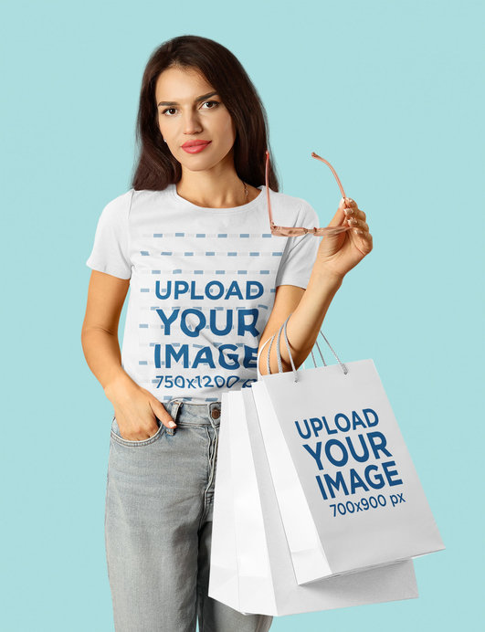 T-Shirt Mockup Featuring a Woman Holding Paper Bags