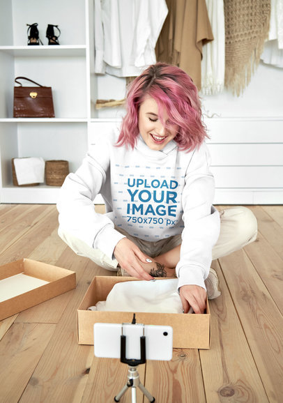 Hoodie Mockup of a Woman Recording an Unboxing at Home M9742-r-el2