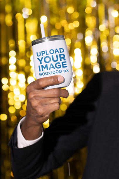 New Year-Themed Mockup of a Man Holding a Wine Tumbler