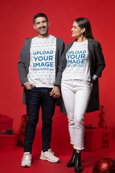 Sweatshirt Mockup of a Man and a Woman at a Christmas-Decorated Setting