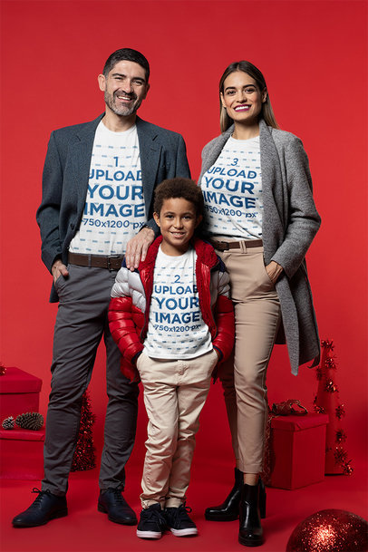 T-Shirt Mockup of a Fashionable Family Posing in a Christmas Setting