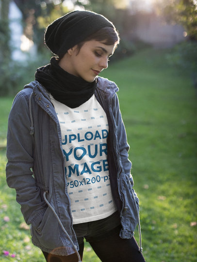 Woman Wearing a Tshirt Mockup and a Gray Jacket Outdoors