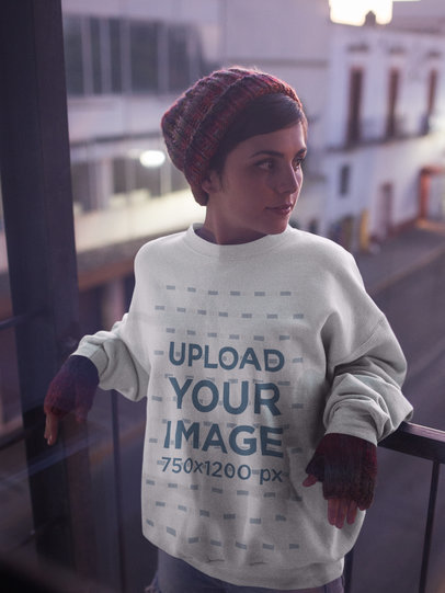 Pretty White Woman Wearing a Crew Neck Sweatshirt Template while on a Balcony