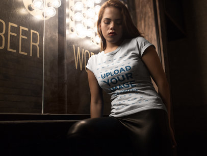 Pretty Woman at a Bar Wearing a Round Neck Tee Mockup