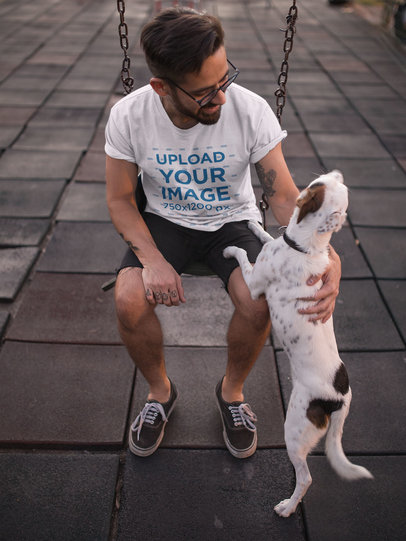 T-Shirt Mockup of a Man Petting His Dog at a Playground