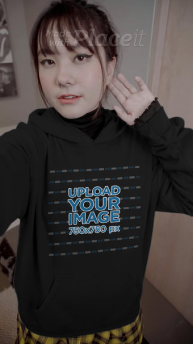 Hoodie Video of a Young Woman Taking a Selfie