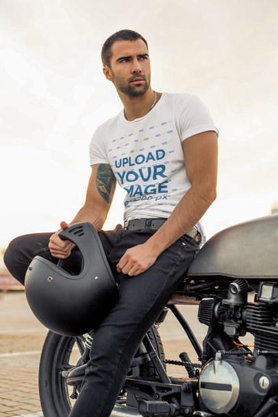 Round-Neck Tee Mockup Featuring a Tattooed Stylish Man Posing on a Bike