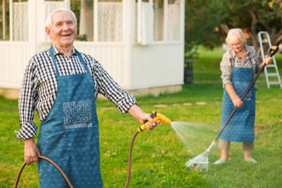 Apron Mockup Featuring a Happy Senior Couple Watering the Garden