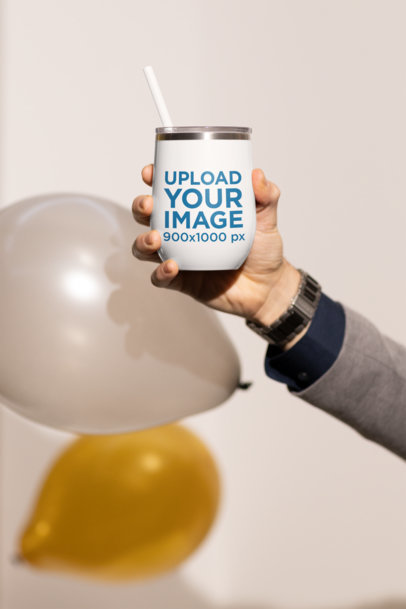 Mockup Featuring a Man’s Hand Holding a Wine Tumbler m20077