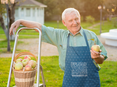 Apron Mockup of a Smiling Senior Man Picking Up Apples