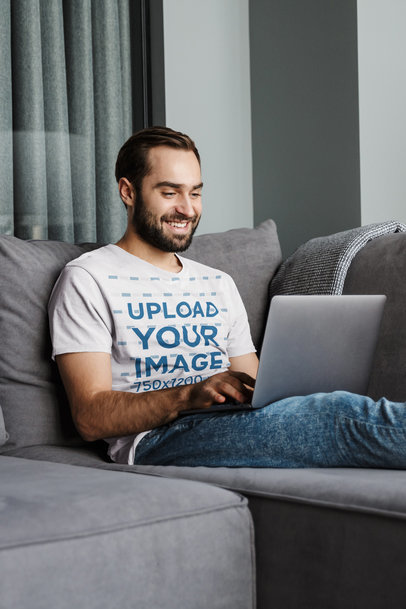 T-Shirt Mockup of a Happy Bearded Man Working from Home