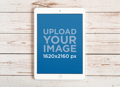 Mockup of an iPad Mini Placed on a Wooden Surface m20127-r-el2