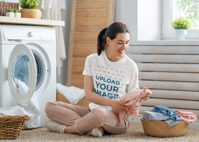 T-Shirt Mockup of a Woman Smiling While Doing Laundry