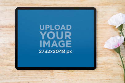 Digital Mockup of an iPad Laid in Landscape Position over a Wooden Surface M20267-r-el2