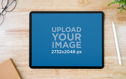 Mockup Featuring an iPad Pro Placed on a Wooden Desk 