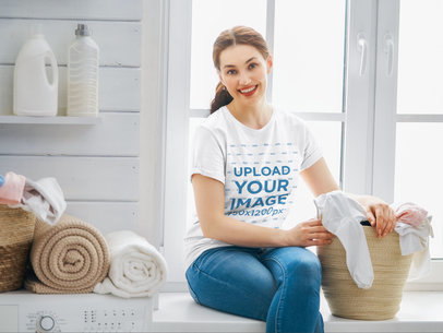 T-Shirt Mockup Featuring a Happy Woman Doing Laundry