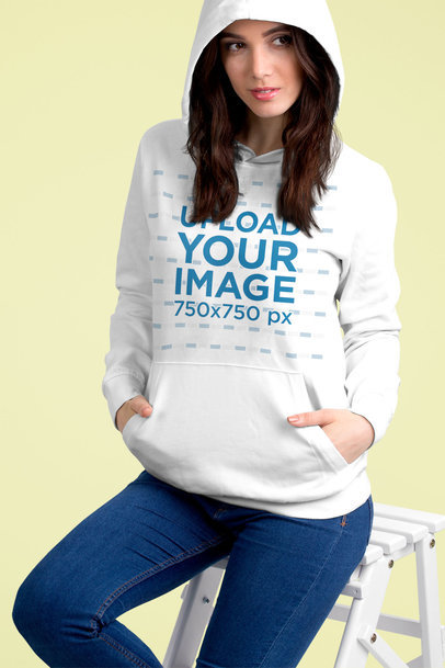 Pullover Hoodie Mockup Featuring a Woman Sitting on a White Stool 5313 el1