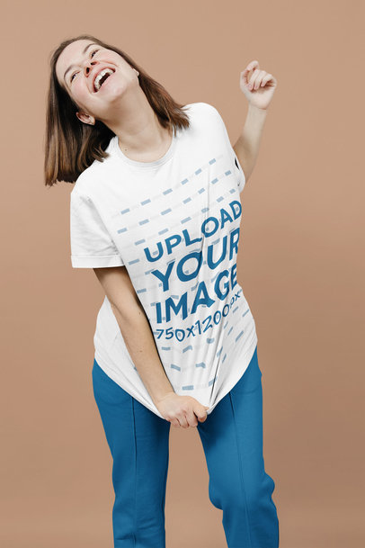 Round-Neck Tee Mockup of a Joyful Woman Laughing at a Studio