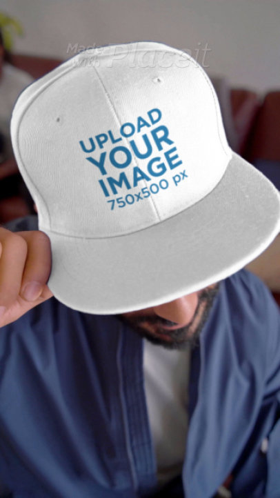 Video of a Happy Man Wearing a Snapback Hat at a Football Watching Party