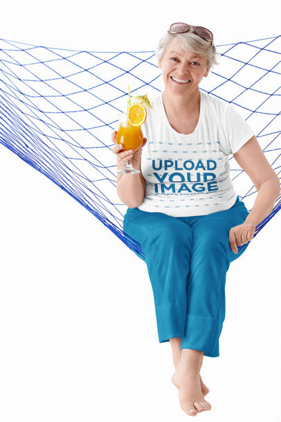 T-Shirt Mockup of a Smiling Elderly Woman on a Hammock Holding a Cocktail m20147-r-el2