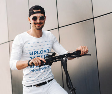 Long Sleeve Tee Mockup Featuring a Happy Man Riding a Scooter