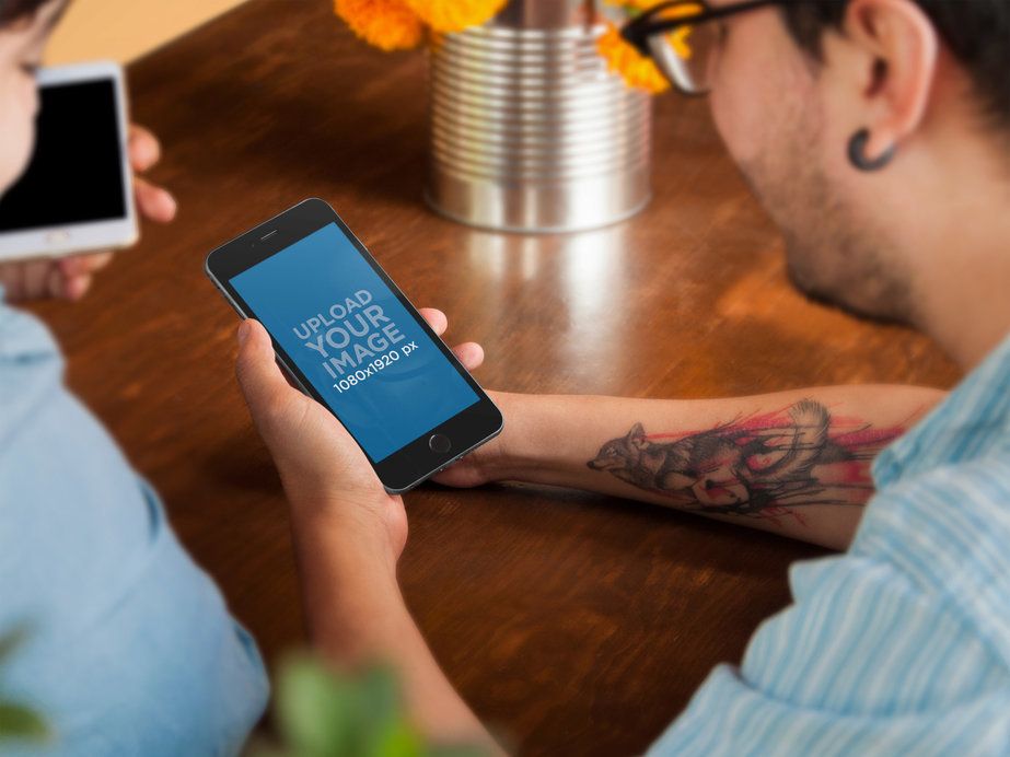 Mockup of an iPhone 6 Plus at an Informal Meeting
