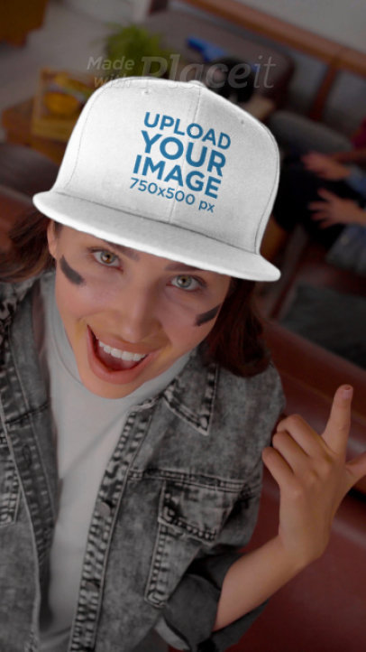 Video of a Woman Pointing at Her Snapback Hat While Enjoying the Big Game