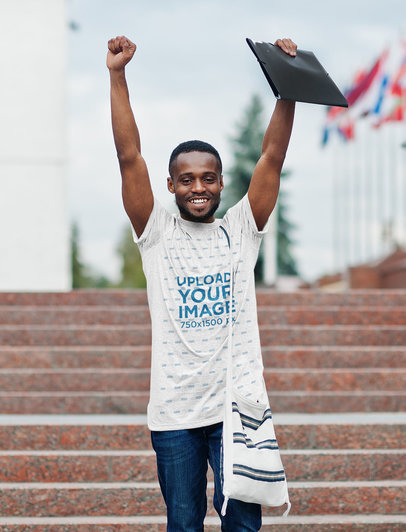 Heathered Tee Mockup of a Joyful Man Lifting His Arms in a Cheering Position
