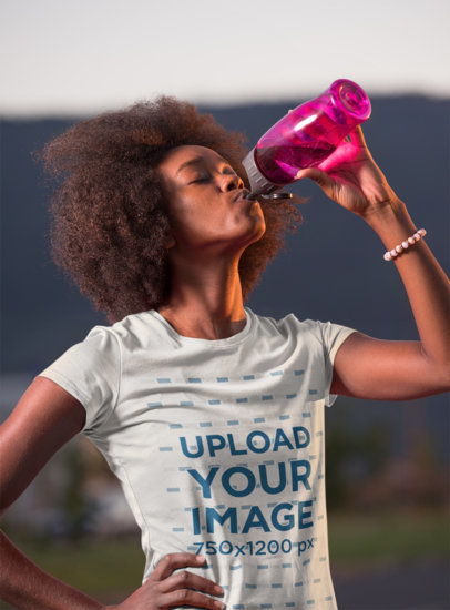 T-Shirt Mockup Featuring a Curly-Haired Woman Drinking Water After a Run