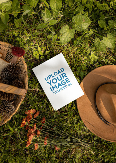 Cottagecore-Themed Mockup of a Postcard Lying on the Grass M18750