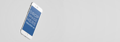 Wide Mockup of a White iPhone 6 Floating on a Grey Area