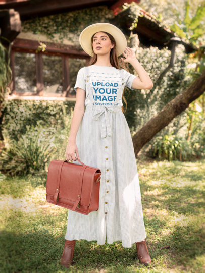 Cottagecore Aesthetic-Themed T-Shirt Mockup of a Woman in the Countryside