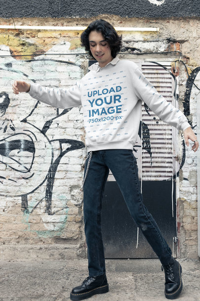 Sweatshirt Mockup of a Happy E-boy Posing Against a Graffiti Wall