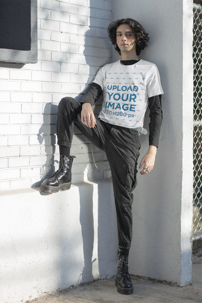 Bella Canvas Tee Mockup Featuring an E-boy Leaning Against a Wall
